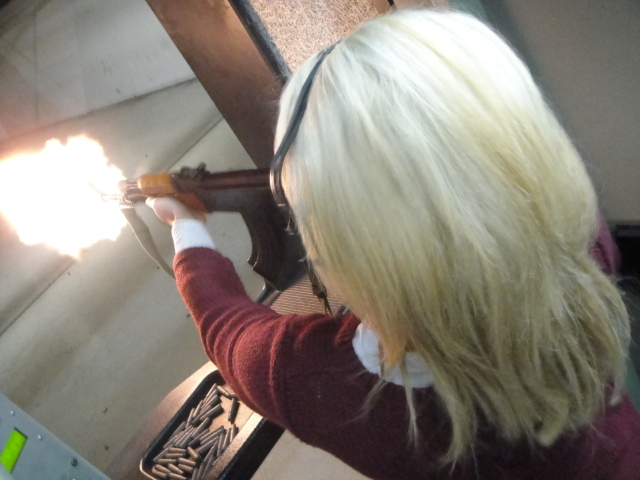 Student Tess Mailman unleashes a massive AK-47 barrel flash during the practical session